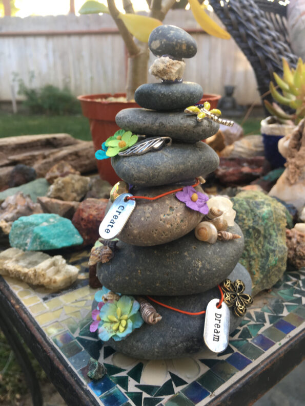 A stack of rocks with tags on them.