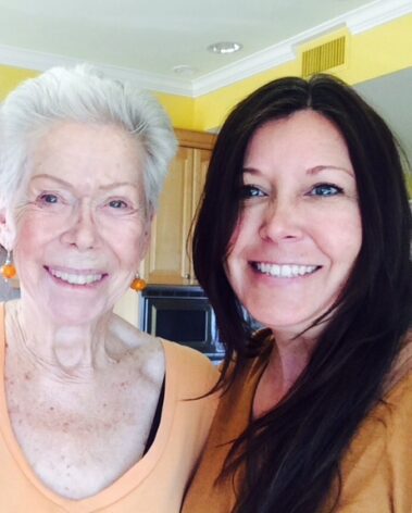 A woman and an older lady smiling for the camera.