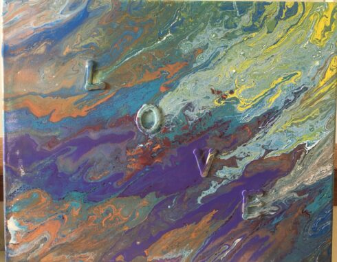 A painting of the word love on it.