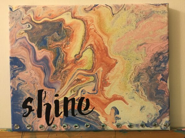 A painting of the word sunshine on top of it.